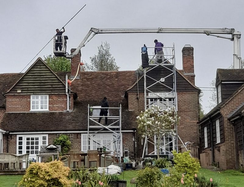 The Roof Moss Cleaners using cherry picker and scaffolding to clean roof safely and professionally in Prestwood, Buckinghamshire
