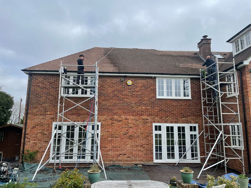 Roof cleaning carried out safely from scaffold towers by The Roof Moss Cleaners in Prestwood